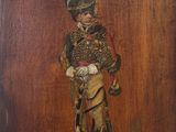 painting of a man in a military uniform on a wooden plaque