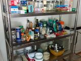 a metal shelving with many different items on it