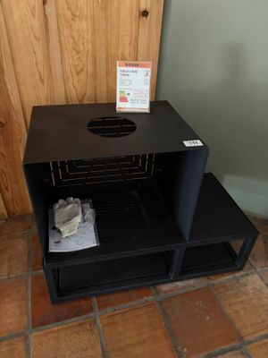 a black shelf that has some items in it