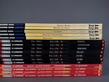 several books stacked on top of each other on a table