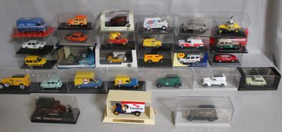 many different types of toy cars in a display case