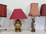 three lamps that are sitting on a white table