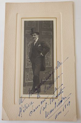 an old photo of a man in a suit and top hat