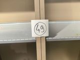 a sign that says 40 on the side of a metal shelf