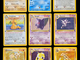 the pokemon cards are lined up on a black background