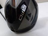a close up of a golf driver ' s helmet on a table