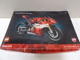 the box of a lego motorcycle is sitting on a table