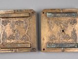 pair of antique brass door handles with a scene of a man and a woman