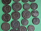 a close up of a bunch of coins on a green surface