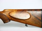 a close up of a rifle on a white background