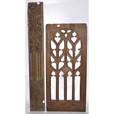 a pair of carved wood doors with decorative designs