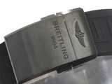a close up of a watch on a metal surface