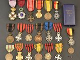 an assortment of medals and medals are displayed on a table