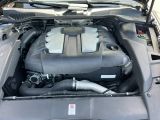 the engine of a car with its hood open and the hood down