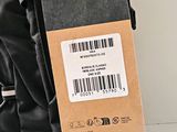 a tag on the back of a backpack with a barcode on it