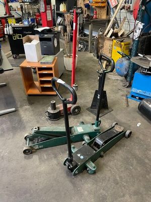 a garage with a lot of tools and tools on the floor