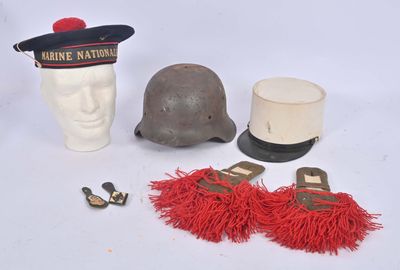 a helmet, a hat, and other items that are on a table