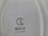 an image of a close up of a plate with a logo on it
