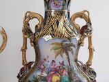 two vases that have been decorated with a painting on them