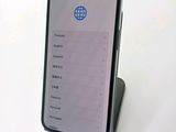 a phone that is sitting on top of a stand