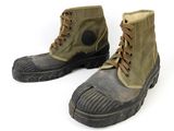 pair of military boots on a white background with a white background