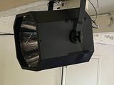 a black light that is hanging from the ceiling in a room