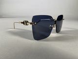 sunglasses with a gold chain and blue lenses on a white surface