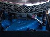 a close up view of a car ' s engine with the hood up