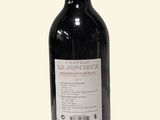 a bottle of wine that is sitting on a table