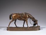 bronze statue of a horse and a dog on a wooden base