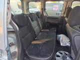 the interior of a van with the door open and the seats folded down