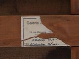 a close up of a sign on a piece of wood