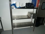 a stainless steel shelving in the corner of a room