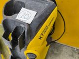 a yellow and black machine that has a sticker on it