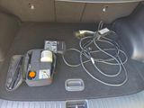 a car trunk with a bunch of wires in it