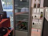 a refrigerator that is sitting in the corner of a room