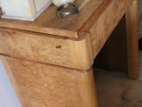 a wooden table with a basket on top of it