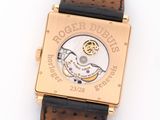 an image of a close up of a watch on a white surface