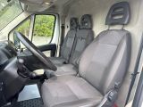 the interior of a van with two seats and a steering wheel