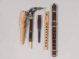 three different types of musical instruments on a white surface