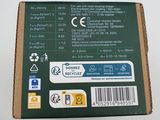 the back of a box with a green label on it