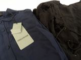 two shirts and a bag with a price tag on a white background