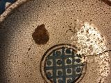 a close up of a plate with a design on it