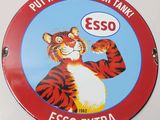 a sign that says put a tiger in your tank esso extra