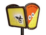 a street sign that has a picture of a man playing a guitar on it