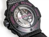 a close up of a watch on a white surface with a black strap
