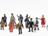 toy figurines of a group of people dressed in different outfits