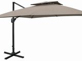 an umbrella with a black base and a beige canopy