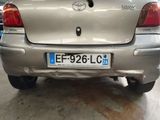 a silver car that is parked in a garage