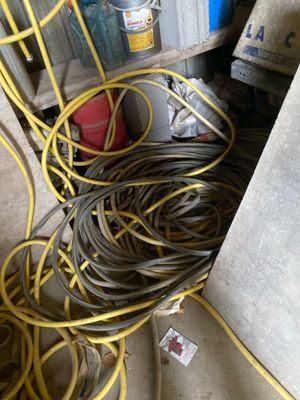 a pile of wires and other electrical equipment on the floor